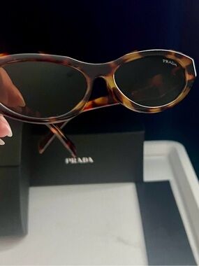 PRADA Sunglasses Symbole Small Oval Acetate Loden
Honey Havana Tortoise Brown